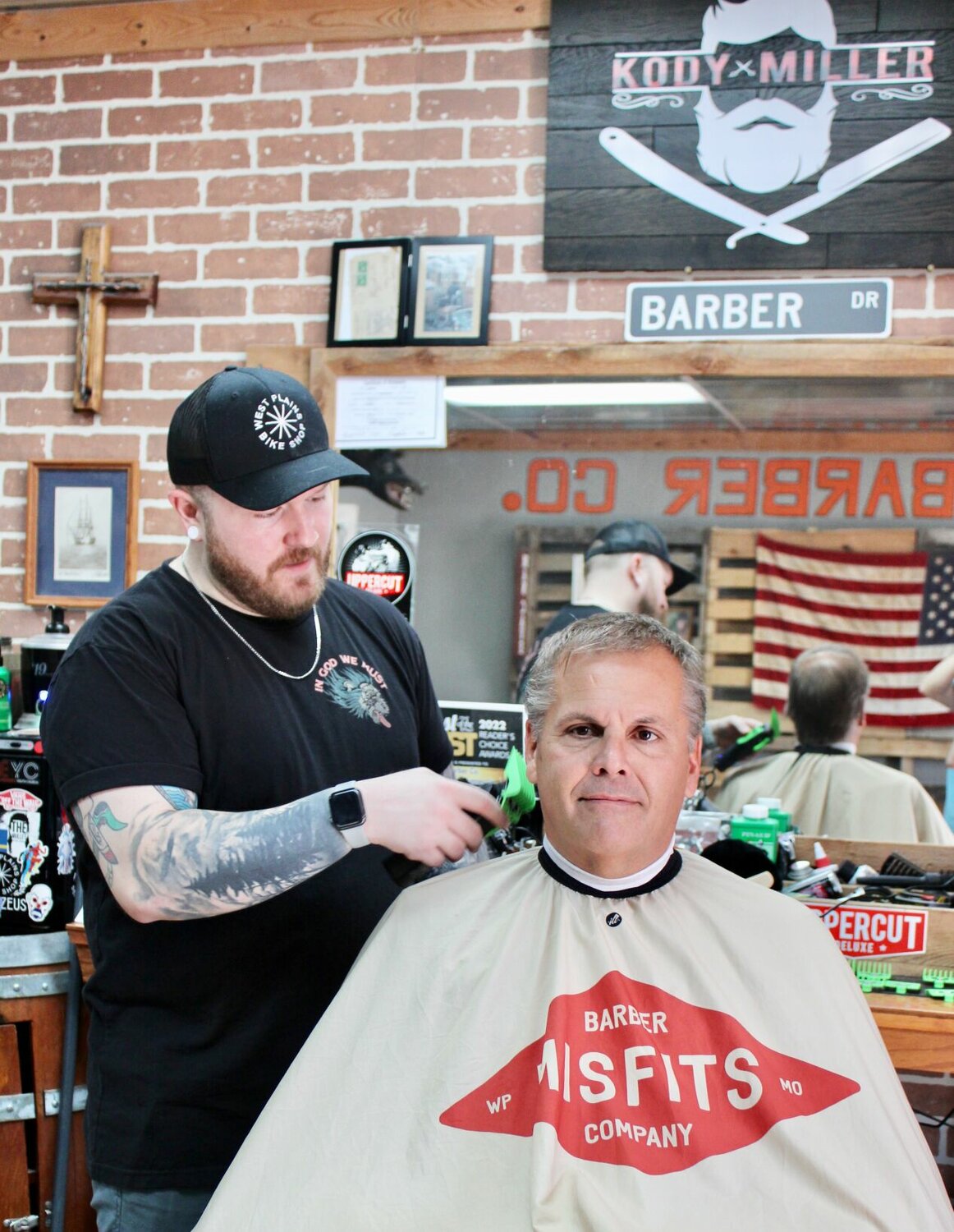 Misfits Barber Co. in downtown West Plains offers haircuts, shaves and beard grooming in a "man cave" setting. The business is open from 10 to 5 p.m. Tuesdays through Fridays and 10 a.m. to 2 p.m. Saturdays, closed Mondays and Sundays, at 301 Washington Ave. Walk-ins are welcome but appointments are preferred and may be made online by visiting the shop's website at misfitsbarber.co, by calling 417-293-5639, or through the Misfits Barber Co. Facebook page, @misfitsbarberco. Barbers are owner Kody Miller and Levi Cox. Here, Miller is starting on a haircut for Ozarks Healthcare President and CEO Tom Keller.
