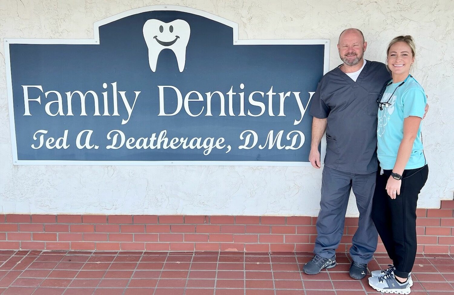 Dr. Ted Deatherage, left, welcomes his daughter, dental hygienist Corey Deatherage, to his dental practice.