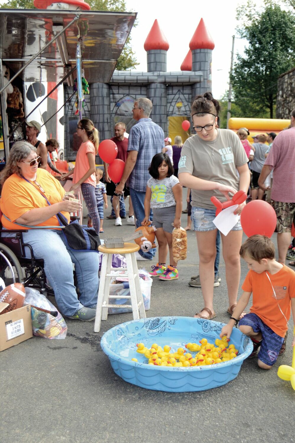 Seven years old at the time this photo was taken five years ago, Lanton resident Daegan Lashley tries to find the lucky duck that will win him a prize. Alton's 38th Black Gold Walnut Festival is this weekend and carnival games will once again be a feature.