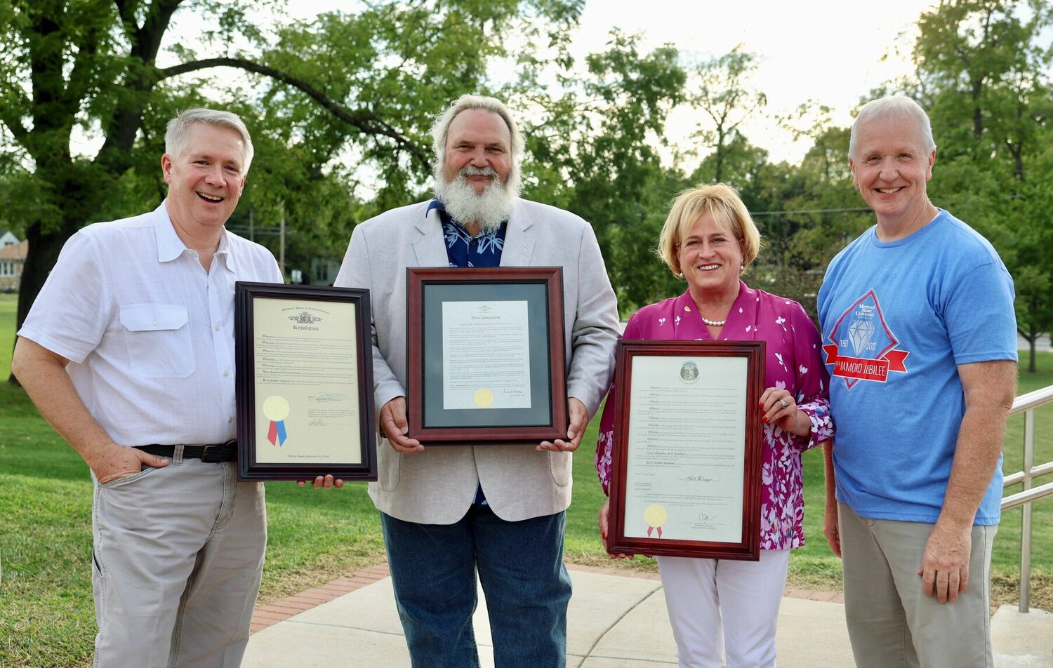 Proclamations from the Missouri State Senate, Missouri House of Representatives and the City of West Plains recognizing Missouri State University-West Plains’ 60th anniversary were presented to Chancellor Dennis Lancaster during the 60th Diamond Jubilee celebration Sept. 16 at the amphitheater. On hand for the presentations were, from left, 154th District State Rep. David Evans (R-West Plains), West Plains Mayor Mike Topliff, 33rd District State Sen. Karla Eslinger (R-Wasola) and Lancaster.