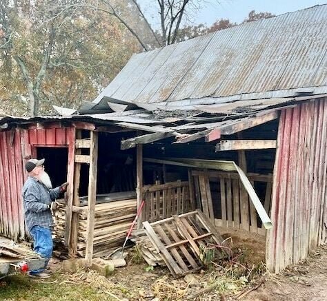 James Brimsberry at the beginning of an ongoing barn restoration project on his property on the western edge of West Plains. The building is about 1,600 square feet and is thought to have been built in the mid-1930s. That estimation is based on a name and written in the concrete foundation of a chicken house on the property that reads "Pearl Mize October 26, 1934." This building was likely used as a cow barn. Brimsberry said the wood that was replaced was oak that had rotted out, and the tin roof has been replaced with a new metal roof.