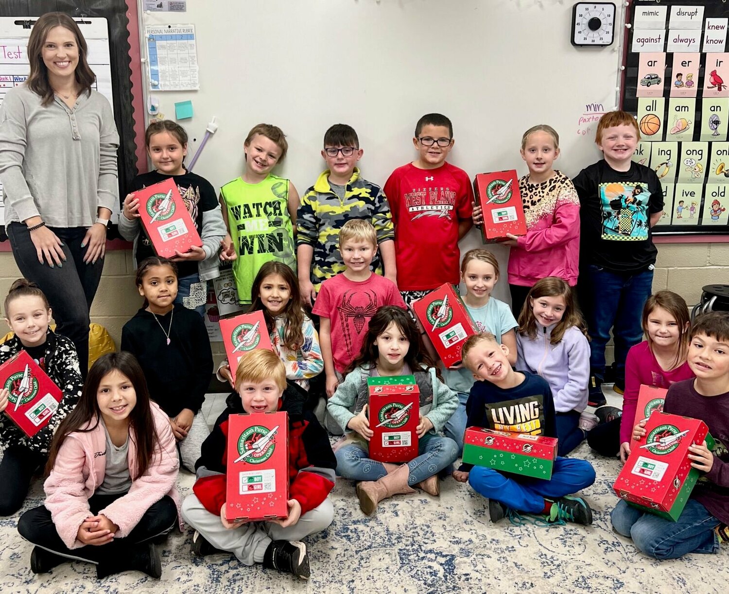 Heidi Schneider's second graders at West Plains Elementary recently teamed up with First Baptist Church to pack 10 boxes filled with gifts for Operation Christmas Child. The boxes will be sent to children around the world. Operation Christmas Child is a project of Samaritan’s Purse, which has the stated mission to show God’s love to children in need and share the gospel of Jesus Christ. Learn more at samaritanspurse.org/occ.