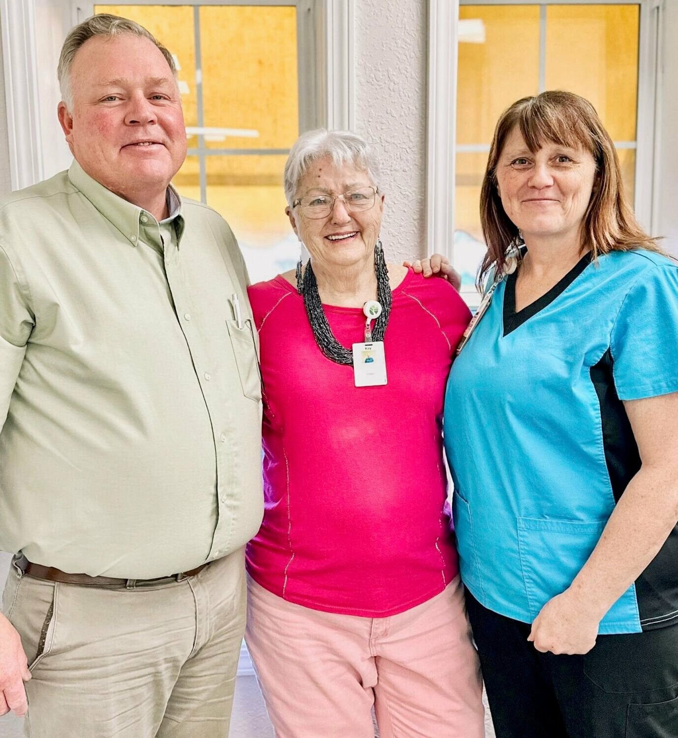 Kay “Katie” Dowler, center, stands with with Tammy McCall, social worker, right, and Eric Bowman, hospice chaplain, at Ozarks Healthcare At Home: Hospice.