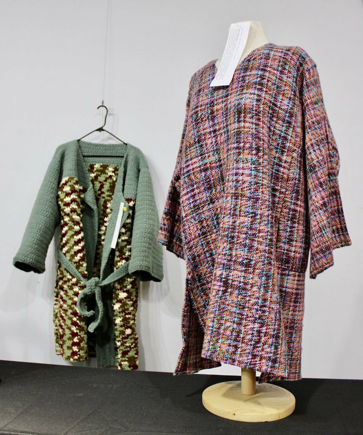 The 2024 Harlin Museum Fiber Arts Show on display through Feb. 18 at the museum, 405 Worcester St., in West Plains, features handcrafted quilts, clothing and other pieces featuring various textile techniques. Shown from left are a knitted robe entered by Darlene Stout and a woven tunic entered by Gena Stout. Votes for a People's Choice Award will be taken through the end of the exhibit. Museum hours are noon to 4 p.m. Thursdays through Sundays. Admission is free with donations accepted to go toward the operation and upkeep of the nonprofit museum, which hosts shows for area artists in different mediums throughout the year. The museum also houses a permanent collection of art by Shannon County native L.L. Broadfoot and historical items representative of daily life in the Ozarks.